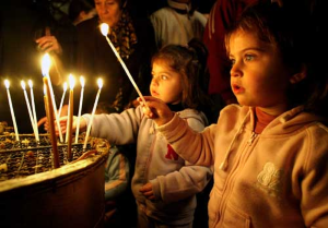 Child lighting candle